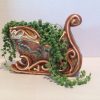 Mature String of Pearls in Ceramic Sleigh,